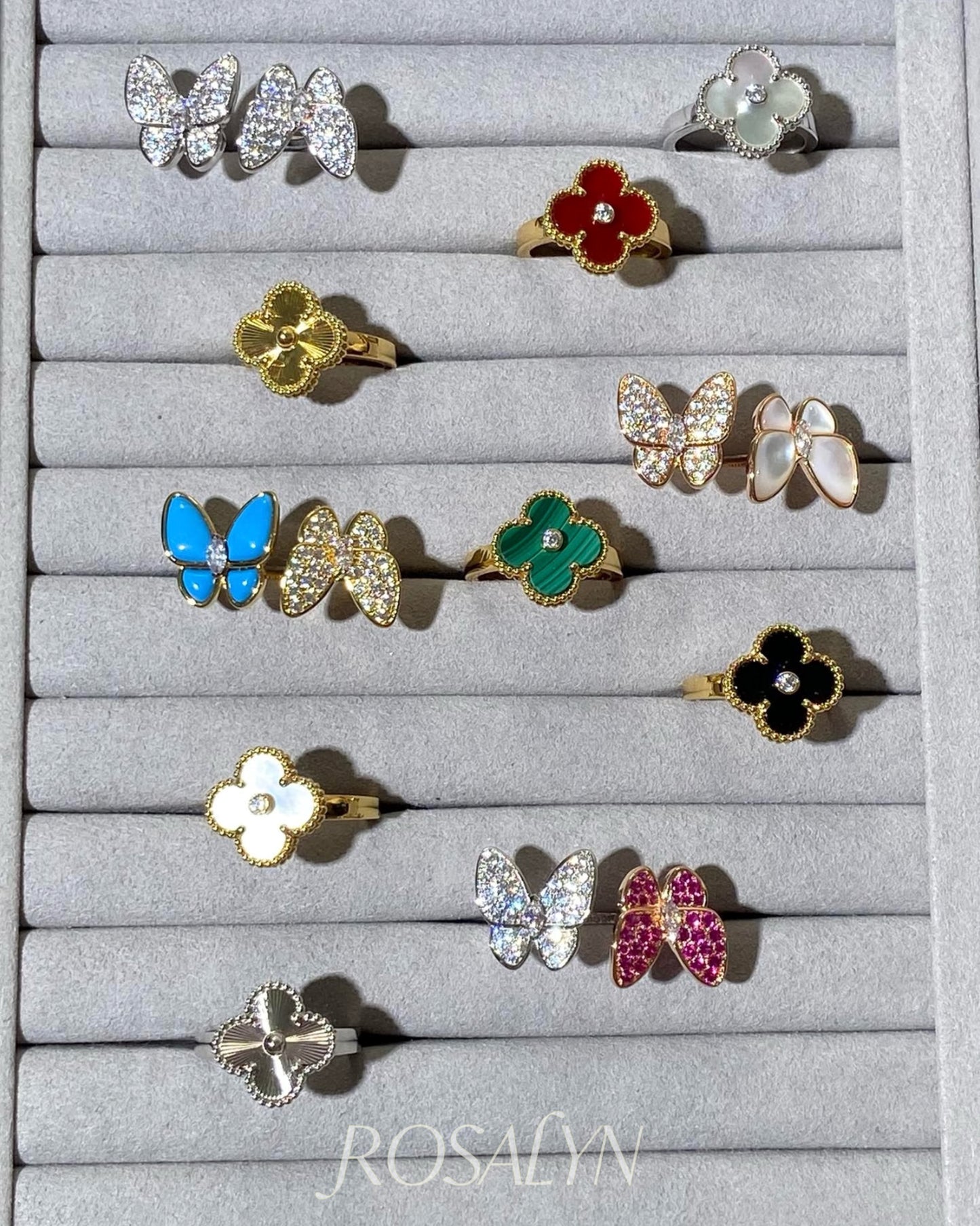 BUTTERFLY RING BETWEEN FINGERS