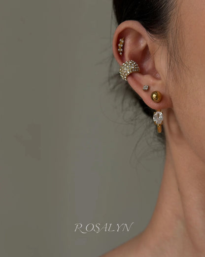 embrace the earrings in the opposite direction