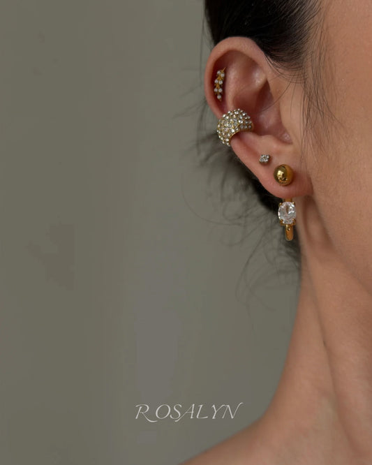 embrace the earrings in the opposite direction