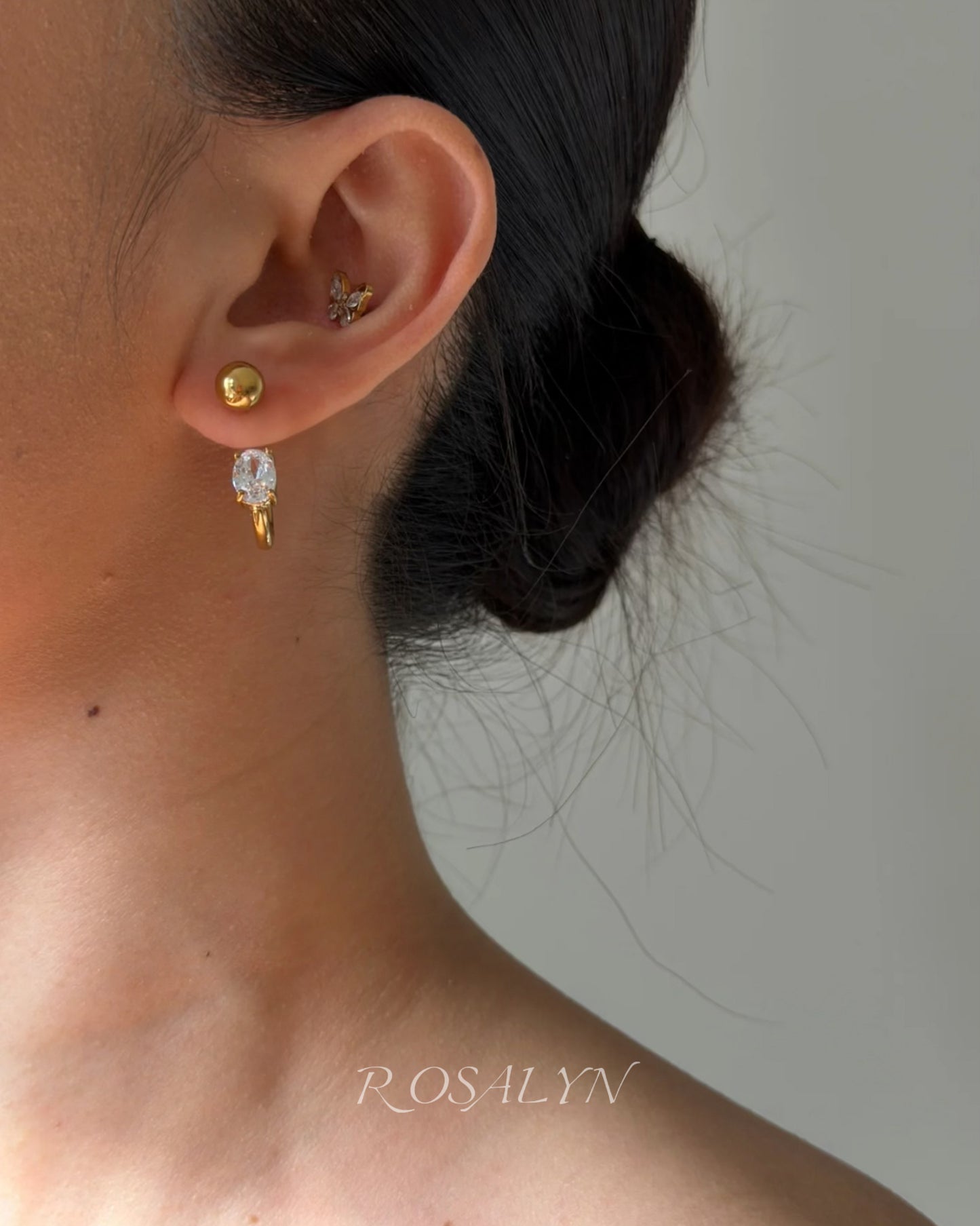 embrace the earrings in the opposite direction
